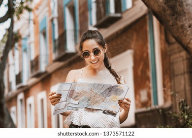 Tourist Latin Girl With Map, Travel, Leisure, Holidays In A Hispanic And Colonial City In Mexico