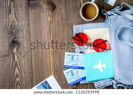 tourist lifestyle with tickets and passport wooden table backgro
