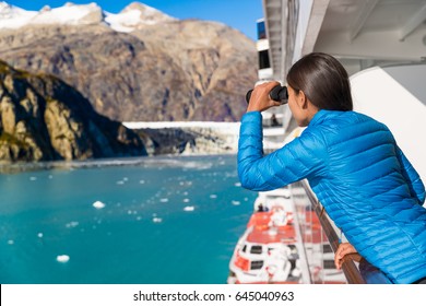 Tourist Looking At Alaska Glacier Bay Nature Landscape Using Binoculars On Cruise Ship. Whale Watching From Boat. Luxury Travel In USA.