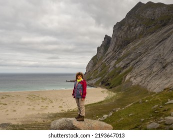 The Tourist Is Looking At The Sandy Beautiful Beach Of Bunes, Lofoten, Norway, Northern Europe