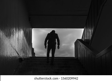 Tourist Man, Going Up To The City, Climbing Stairs On The Pedestrian Subway. Family Concept In City