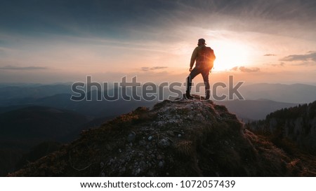 Tourist man hiker on top of the mountain. Active life concept