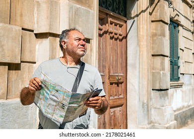 Tourist Man On The Street Looking Map Wondering Where He Should Go. Urban Traveling Leisure. Travel Guide, Tourism In Europe.