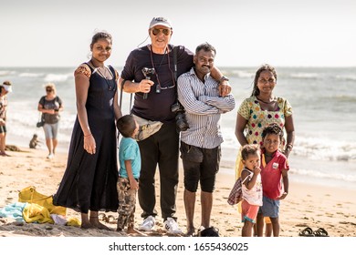 Tourist Man Taking Pictures At The Beach With Indigenous People In India Goa (Mormugao). 30.January.2020 Goa, India
