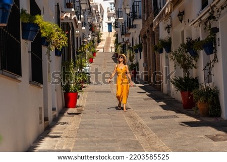 A tourist in Mijas visiting the white houses and charming town. Malaga, Andalusia