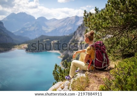 Tourist in the mountains in Switzerland on Lake Oeschinensee