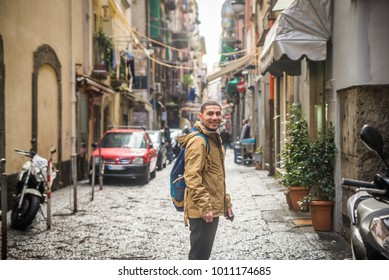 Tourist in Naples walking along the crowded, busy streets, Italy