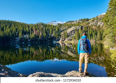 Tourist near Bear Lake at autumn in Rocky Mountain National Park. Colorado, USA. 