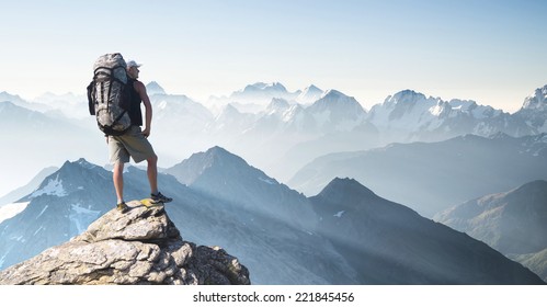 Tourist on high rocks. Sport and active life concept 