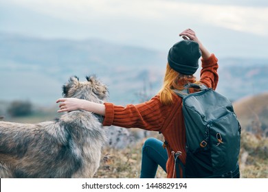 Tourist On Nature With A Backpack On His Back And Dog Pet Best Friend            