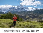 Tourist on the way to the imposing Fitz Roy mountain, Argentina. Happy young man on the way to Fitz Roy in Argentine Patagonia. Confident mountaineer before climbing Fitz Roy in Argentina