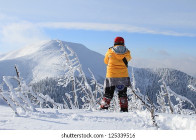 Tourist on winter walk in mountains - Shutterstock ID 125339516