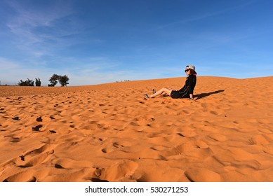 Tourist In Red Sand Dunes, Mui Ne, Vietnam.