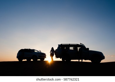 Tourist Relax At Sunset Desert With Extreme Car