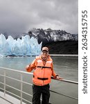Tourist sailing on Grey Lake, observing the Grey Glacier, located in Chilean Patagonia, in the Southern Ice Fields, within Torres del Paine National Park.
