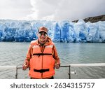 Tourist sailing on Grey Lake, observing the Grey Glacier, located in Chilean Patagonia, in the Southern Ice Fields, within Torres del Paine National Park.
