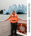 Tourist sailing on Grey Lake, observing the Grey Glacier, located in Chilean Patagonia, in the Southern Ice Fields, within Torres del Paine National Park.
