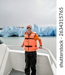 Tourist sailing on Grey Lake, observing the Grey Glacier, located in Chilean Patagonia, in the Southern Ice Fields, within Torres del Paine National Park.
