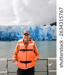 Tourist sailing on Grey Lake, observing the Grey Glacier, located in Chilean Patagonia, in the Southern Ice Fields, within Torres del Paine National Park.
