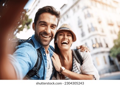 Tourist, selfie and happy couple for travel on city street for holiday memory and happiness. Face of man and woman outdoor for outdoor adventure, journey or vacation for freedom or funny portrait - Powered by Shutterstock