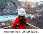 Tourist standing at Huanglong national park in winter, Sichuan in China.