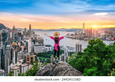 Tourist standing on viewpoint in Hong Kong. - Powered by Shutterstock