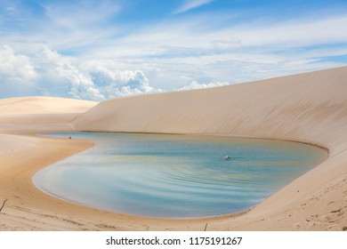 Tourist Swimming At The Lençóis Maranhenses National Park, One Of The Main Touristic Destination In Brasil