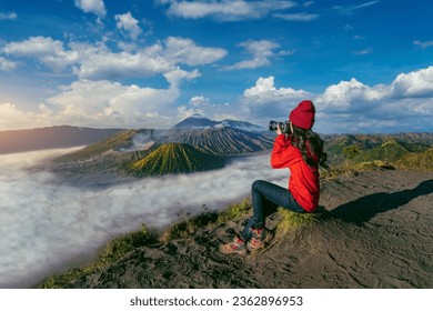 Tourist taking photo at Mount Bromo volcano (Gunung Bromo) in Bromo Tengger Semeru National Park, East Java, Indonesia. - Powered by Shutterstock