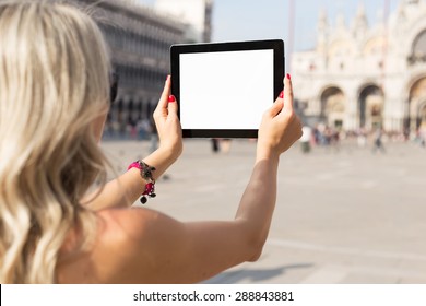 Tourist Taking Photo With Tablet Computer With Empty White Screen