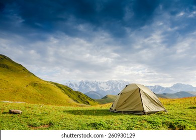 Tourist tent in camp among meadow in the mountain - Powered by Shutterstock