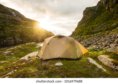 tourist tent near mountain lake, summertime sunset, camping in Norway - Shutterstock ID 1016979688