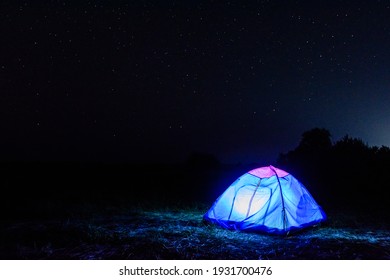 Tourist Tent At Night. Night Sky With Many Stars