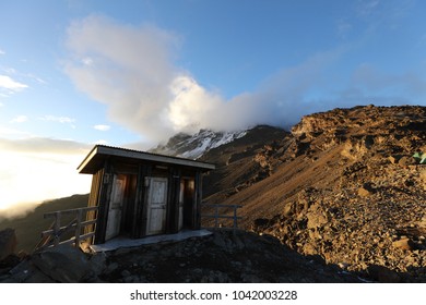 Tourist Toilets At Summit Base Camp Of Mount Kilimanjaro At Sunset, Africa