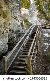 tourist trail with wooden pathwalk and stairs near sandstone cliffs. river gauja in Latvia. The cliff of Sietiniezis. tourist destination - Shutterstock ID 1943066515