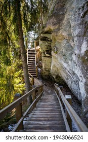 tourist trail with wooden pathwalk and stairs near sandstone cliffs. river gauja in Latvia. The cliff of Sietiniezis. tourist destination - Shutterstock ID 1943066524
