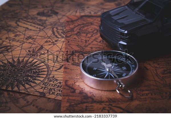 Tourist travel by\
car. Travel by car. Compass and car. Autotourism. Traveling across\
countries by land.