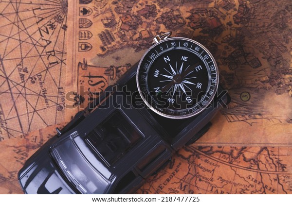 Tourist travel by\
car. Travel by car. Compass and car. Autotourism. Traveling across\
countries by land.