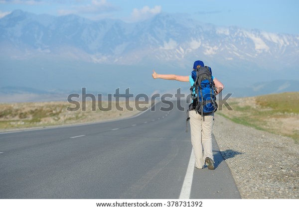 Tourist is trying to stop the\
car