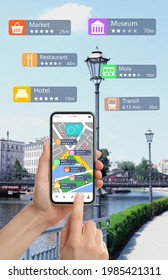 Tourist using online guide application on smartphone for navigation in city, closeup 