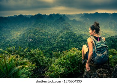 Tourist in Vietnam Backpacker Enjoys the view of The Cat Ba National Park from the Viewpoint - Powered by Shutterstock