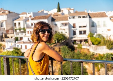 A Tourist At The Viewpoint Of The New Bridge In Ronda Province Of Malaga, Andalusia