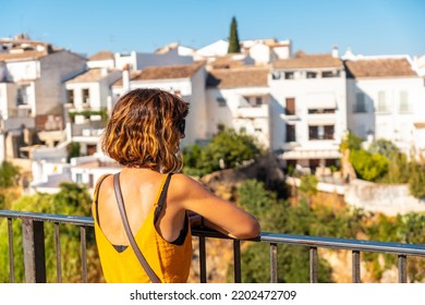 A Tourist At The Viewpoint Of The New Bridge In Ronda Province Of Malaga, Andalusia