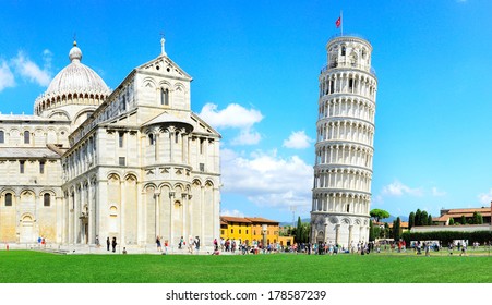 Tourist visiting the leaning tower of Pisa , Italy 