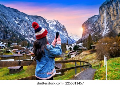 Tourist visiting village of Lauterbrunnen in the Bernese Oberland, Switzerland.