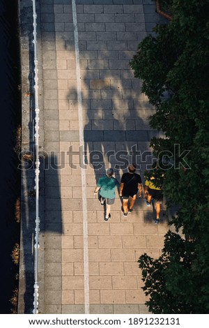 Similar – Image, Stock Photo 2 women walking in the evening light