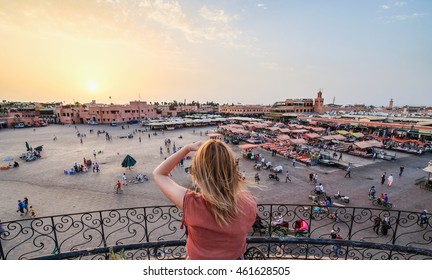 Tourist Watching Over Jamaa El-Fna Market Marrakesh - Morocco. Sunset View.