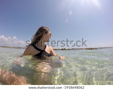 Tourist in the waters of Maragogi beach in Alagoas - Brazil