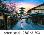 Tourist wearing japanese traditional kimono at Yasaka Pagoda in Kyoto, Japan.