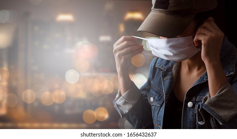 A tourist wearing a mask isolated on city background. Promoting people use face mask to protect themselves from virus infection in Corona virus crisis 2020 - Shutterstock ID 1656432637