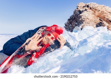 Tourist Winter Lake Baikal, Portrait Man Through Transparent Clear Ice.